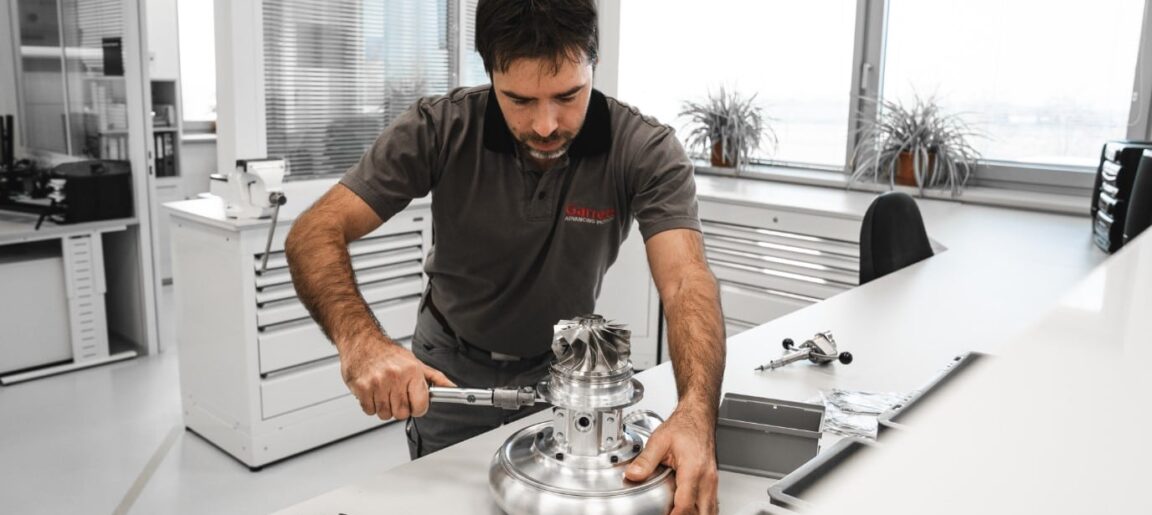 Garrett Motorsport Engineer assembling a turbocharger