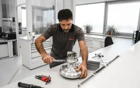 Garrett Motorsport Engineer assembling a turbocharger