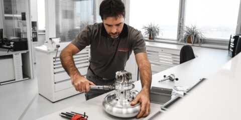Garrett Motorsport Engineer assembling a turbocharger
