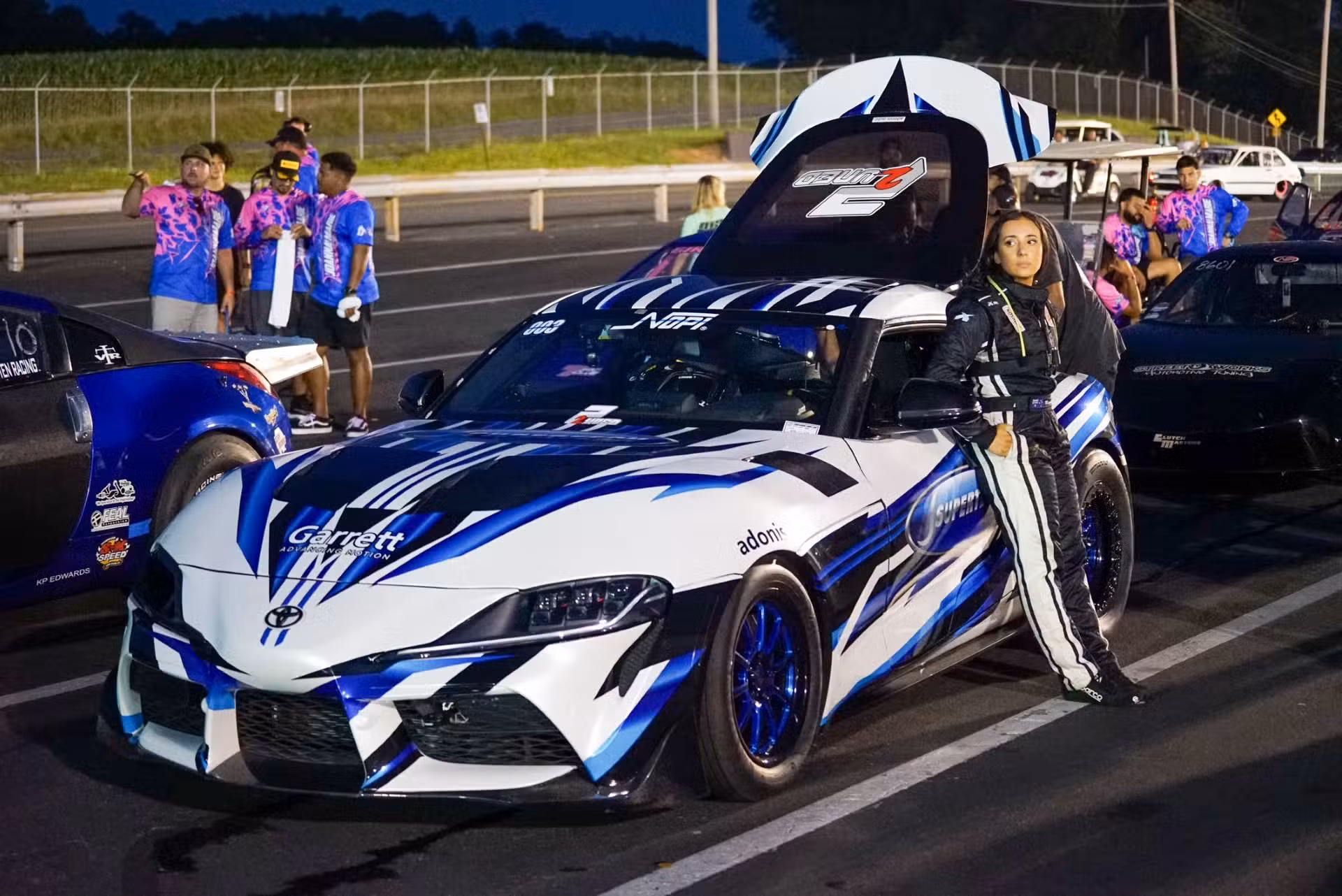 Monique Ambruosi next to her Garrett's boosted race car