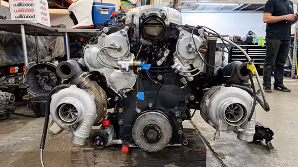 Chris Forsberg Nissan Z engine bay with twin Garrett G-Series II turbochargers